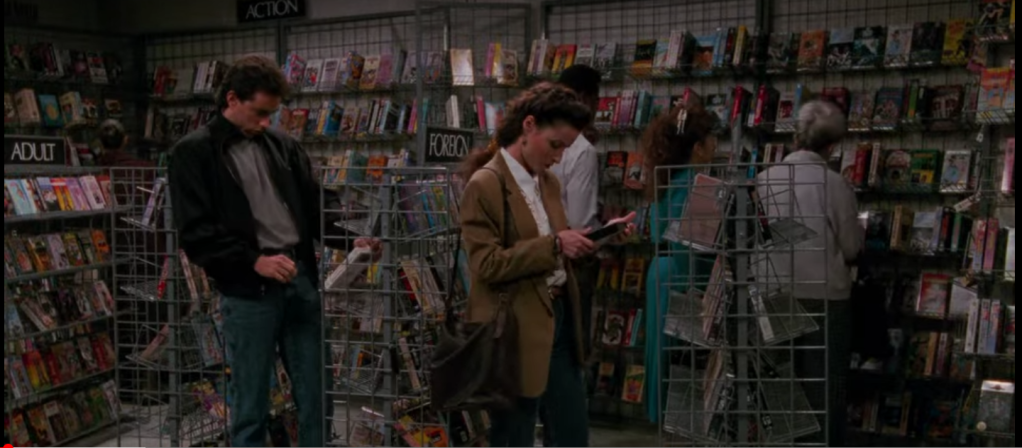 screenshot of the show Seinfeld with Jerry and Elaine browsing the shelves in a video rental store