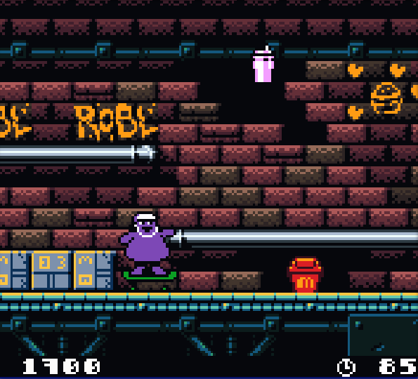 Screenshot from the Grimace's Birthday game. Grimace is underground and riding a skateboard. He's wearing a white helmet. There are grindrails scattered around the screen and a brickwall background. Graffiti is painted on the walls.