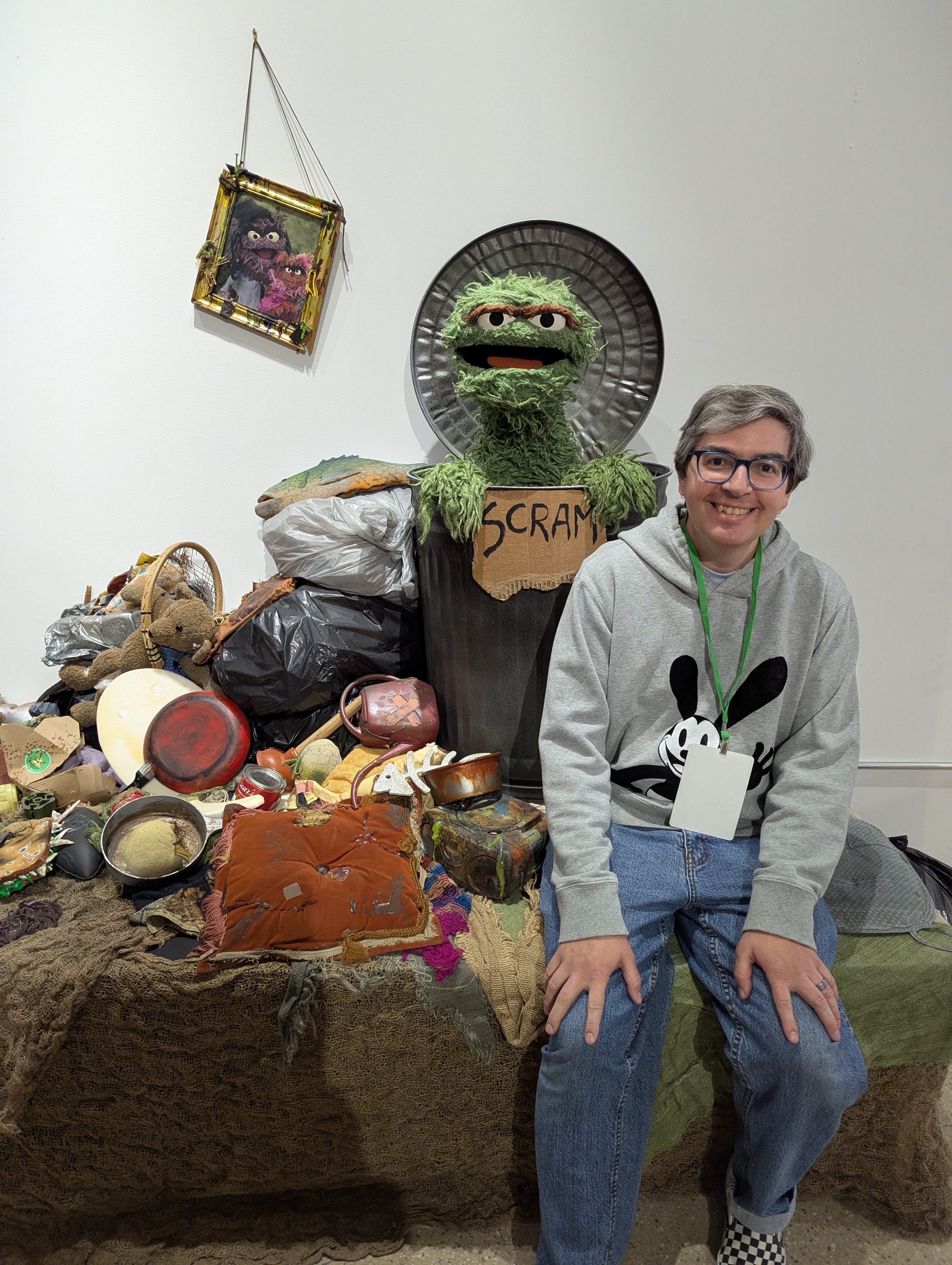me sitting in front of oscar the grouch coming out of his trash can